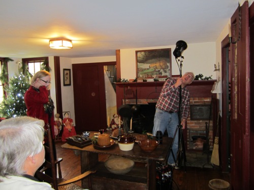 Tess Rosch and Win Ross setting up to take photos in our 1790's kitchen as Brian looks on.