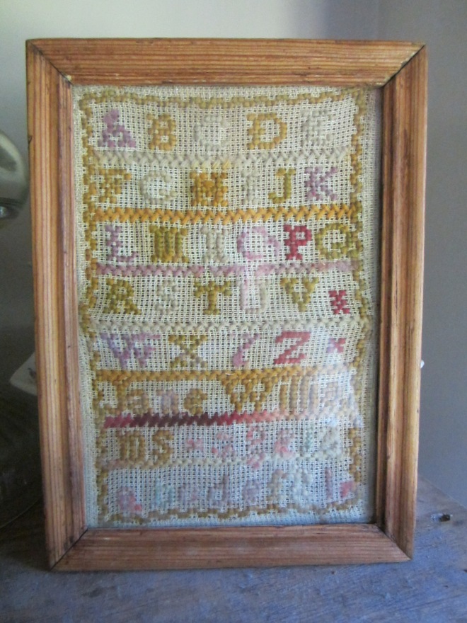 This tiny sampler is later than most of the samplers in my collection AND it needs to be reframed, but it has some of my favorite colors and it was only $15 !!!